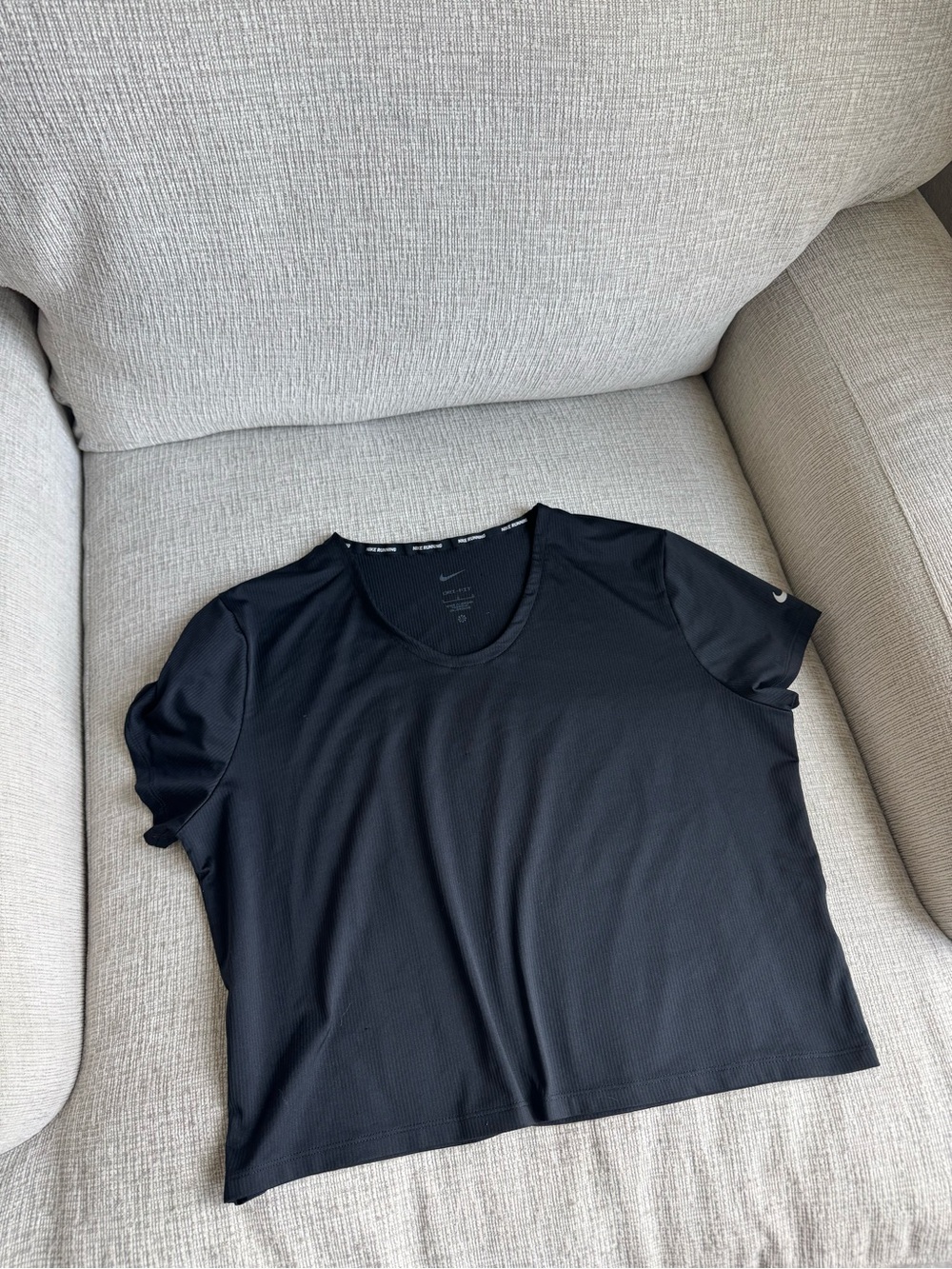 Nike Women's Black Short Sleeve Performance Tee slightly cropped